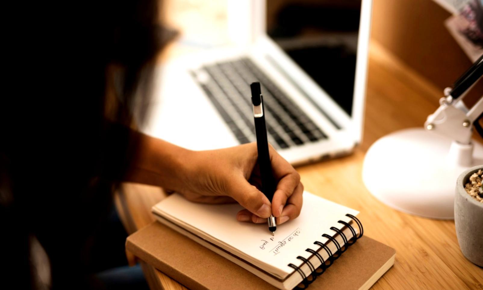 Business professional reviewing financial reports with graphs and charts displayed